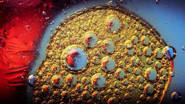 A close-up shot of animal cells being cultivated in a bioreactor, emphasizing the cellular level of cultured meat production. The image should convey a sense of scientific precision and innovation.