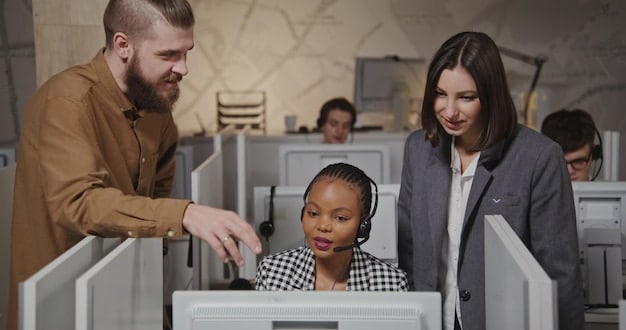 A diverse group of customer service agents working in a modern office environment, using AI-powered tools on their computers, illustrating the integration of AI and human agents in customer service.