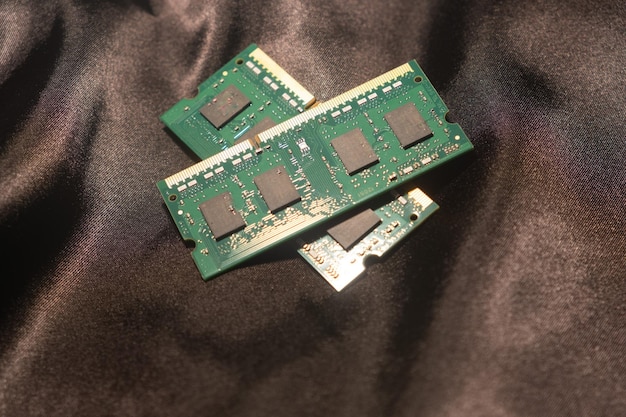 A close-up shot of a laptop's dedicated graphics card (GPU). The GPU is visibly powerful with heat pipes and cooling fins. The scene is lit to highlight the detailed components and advanced technology within the graphics card.